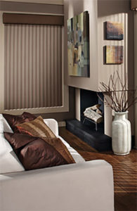Living room decorated in taupe color for wall paint , window coverings, upholstery fabric,