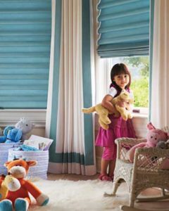 A girl playing with her toys near the window