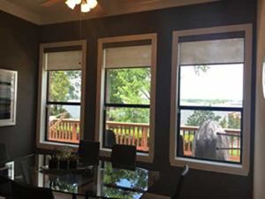 Designer Screen Shades covering the windows of the living room