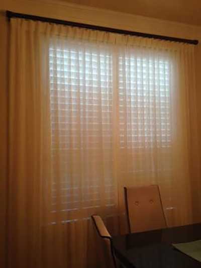 Light coming through Curtains covering the window